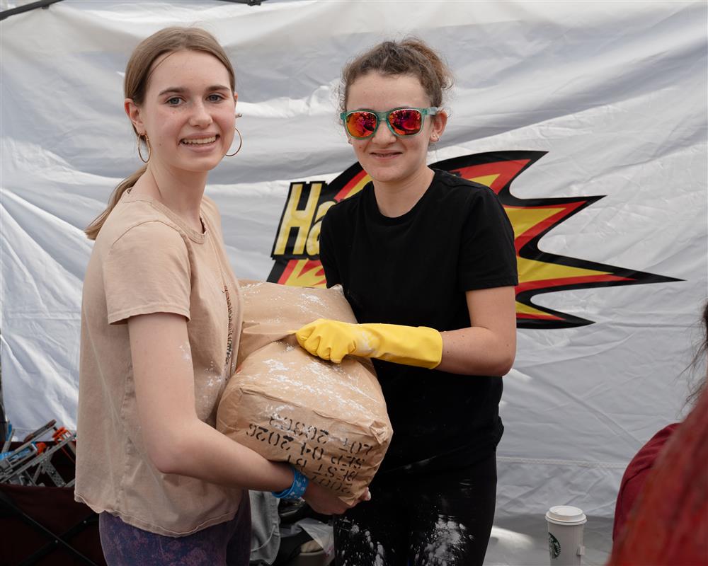 Two students from Hancock Elementary School work on a large volcano together.